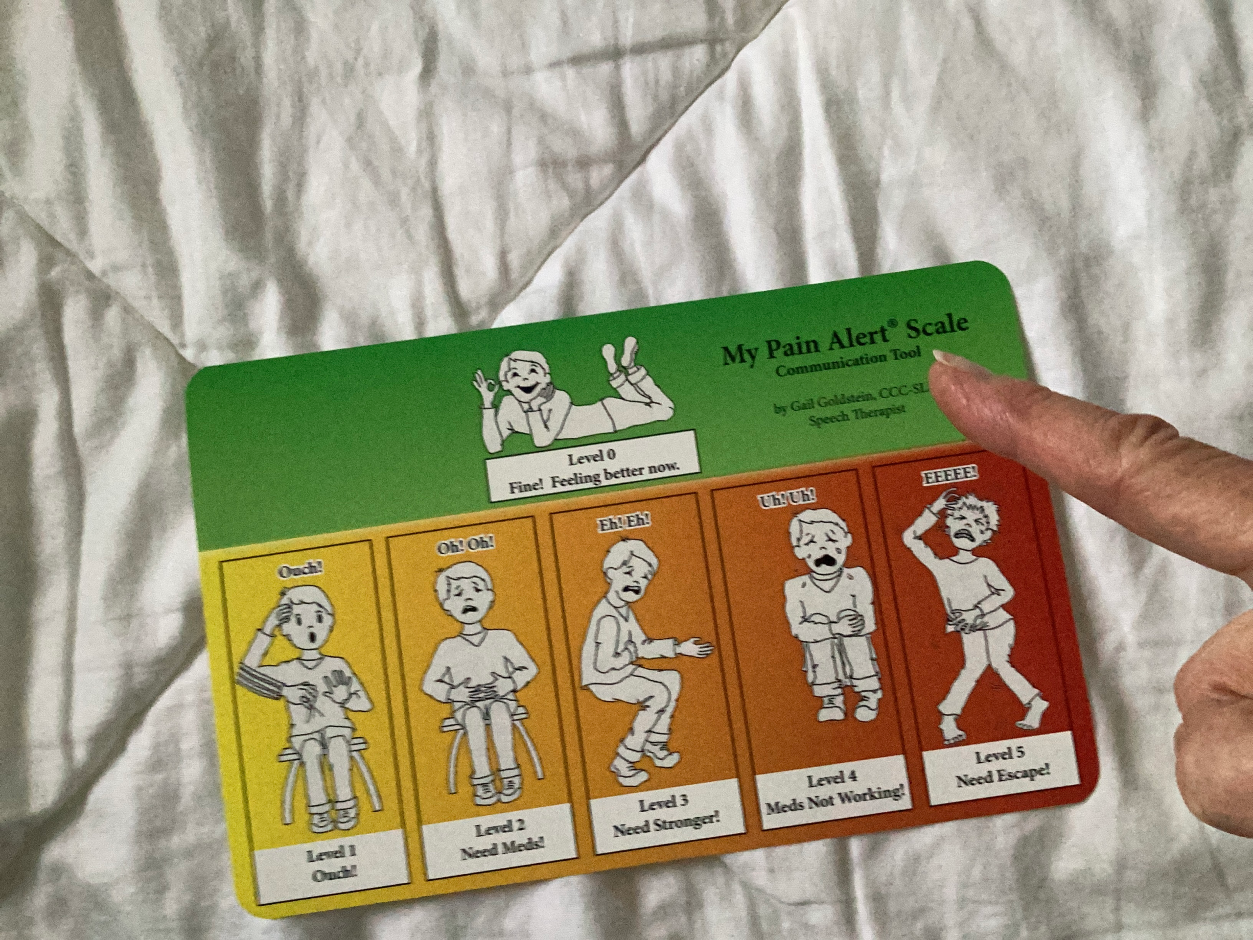 Finger pointing to MPAS card pictures